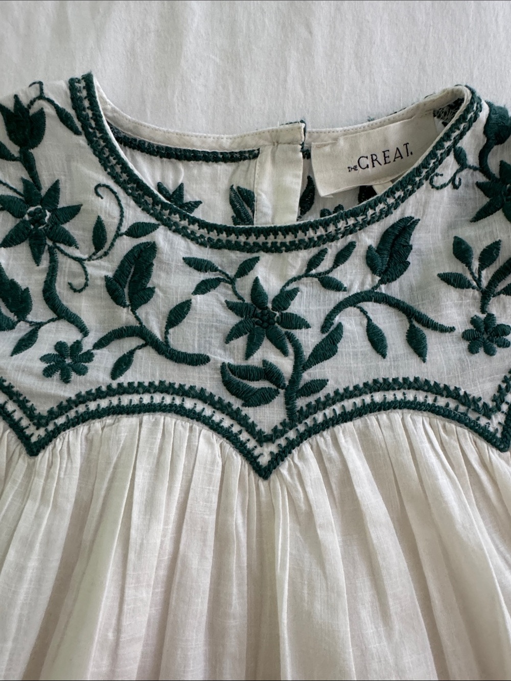 THE GREAT. White Top with Dark Green Floral Embroidery